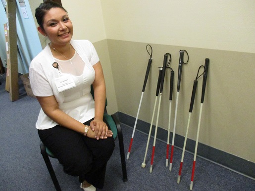 Antonia Quesada sitting next to donated kiddie canes at BSS